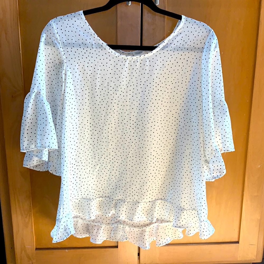 White with black dots flowing top.